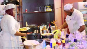 LMAM artiste, Sinach, and her husband making delectable dishes in the President's Kitchen.