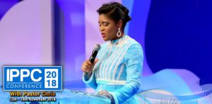Pastor Deola accepts her award